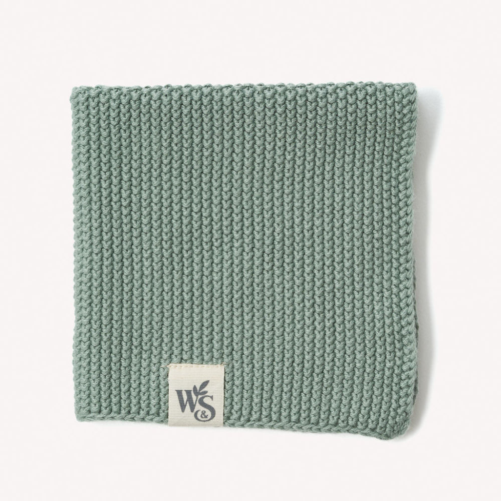 Knitted moss green organic kitchen dish cloth with a logo on a white background