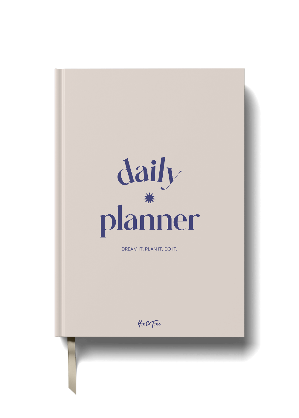 Daily planner book in colour sand with 'daily planner' text on a black background