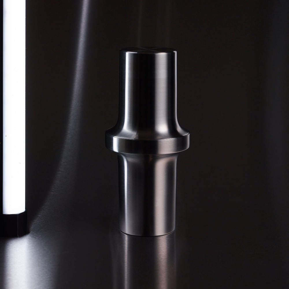 BARBICAN cocktail shaker by Aaron Probyn in brushed stainless steel against a dark background