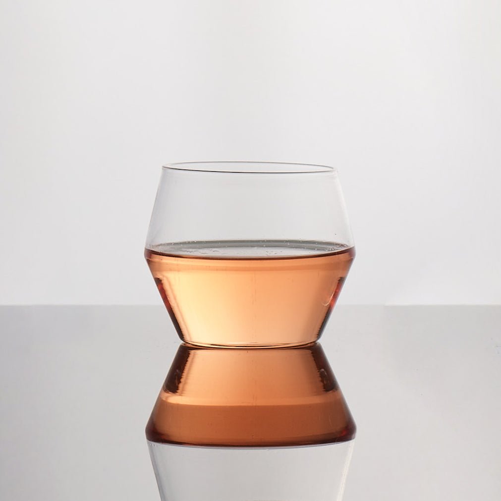 Aaron Probyn JUNIPER geometric whisky tumbler containing an amber-coloured drink