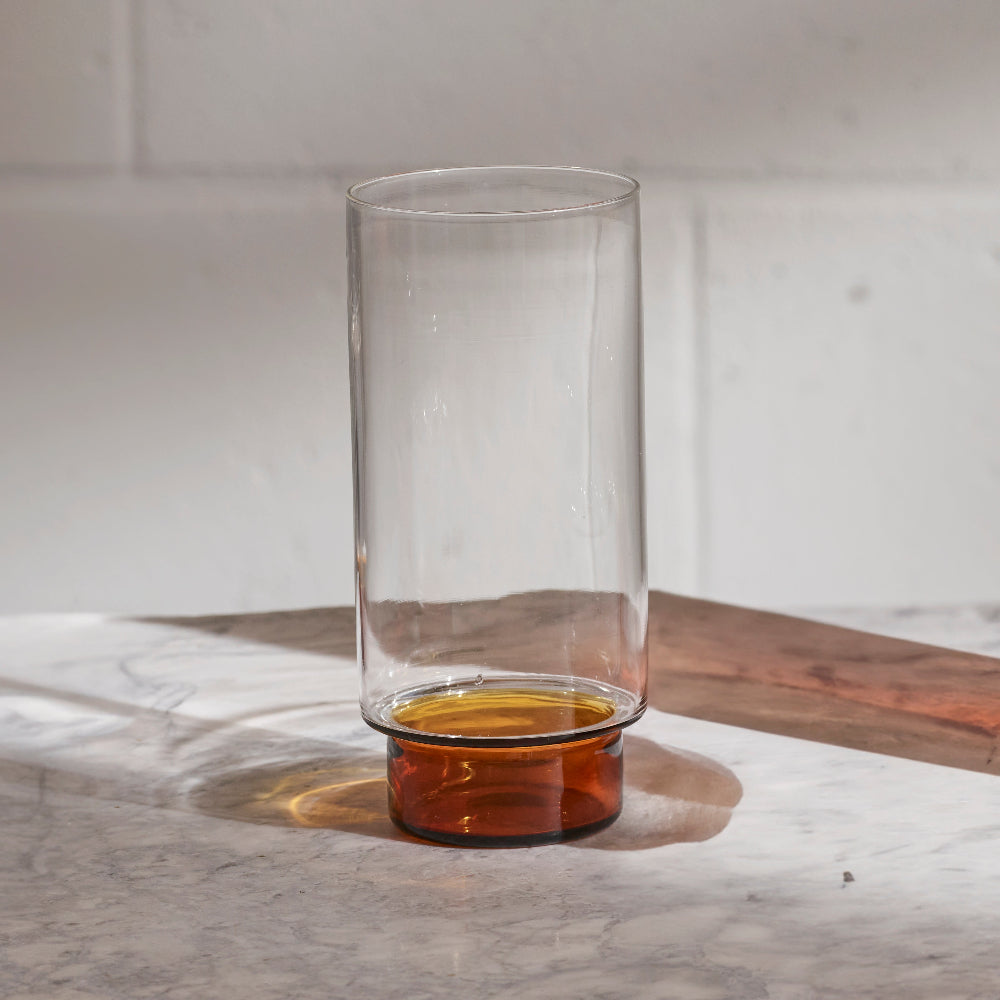 RYE highball drinking glass by Aaron Probyn with clear body and dark amber base