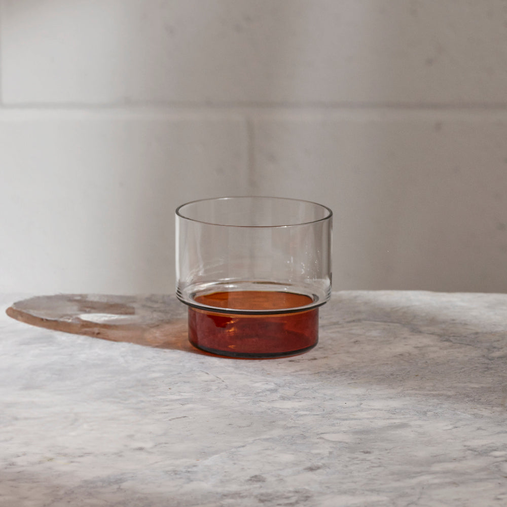 Aaron Probyn RYE whisky tumbler with clear body and dark amber glass base