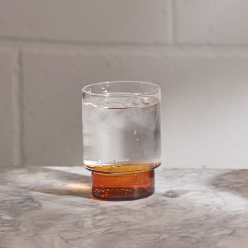 Aaron Probyn RYE stemless wine glasses featuring contrasting dark amber glass bases