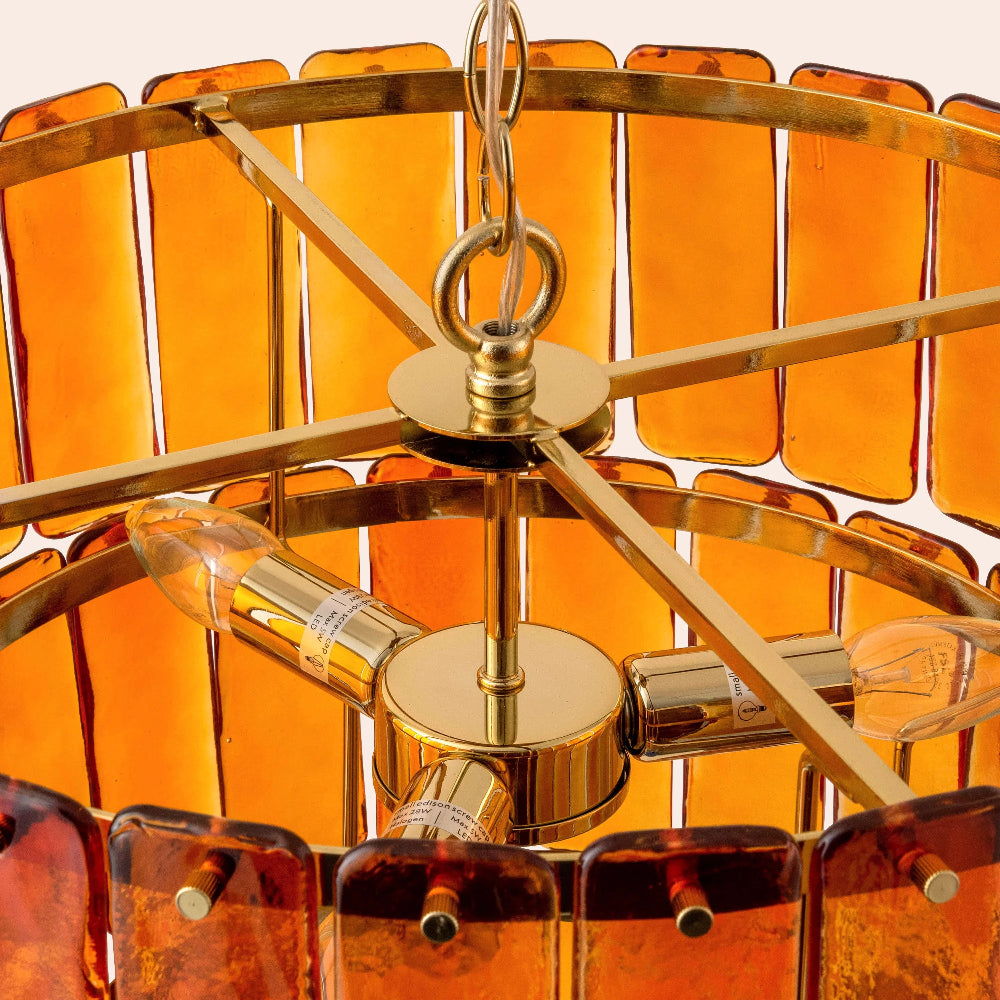 Close-up of handblown amber glass shade and brass detailing