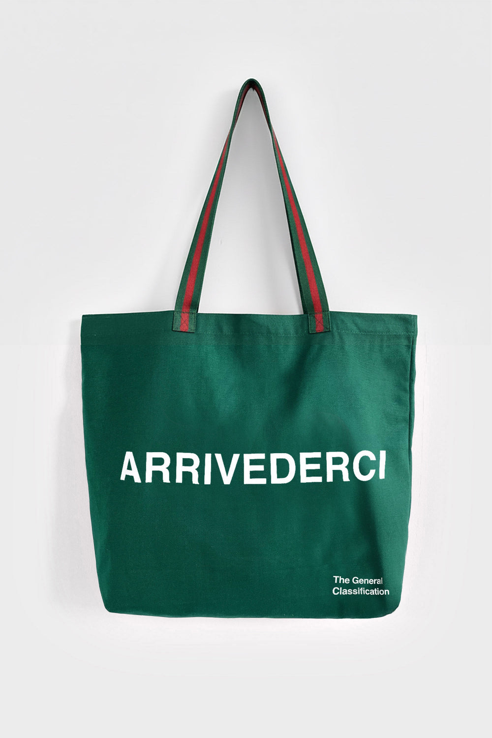A dark green canvas tote bag with green and red striped shoulder straps, featuring the white text 'ARRIVEDERCI' on the front and 'The Genuine Classification' in the bottom right corner, set against a plain light gray background.