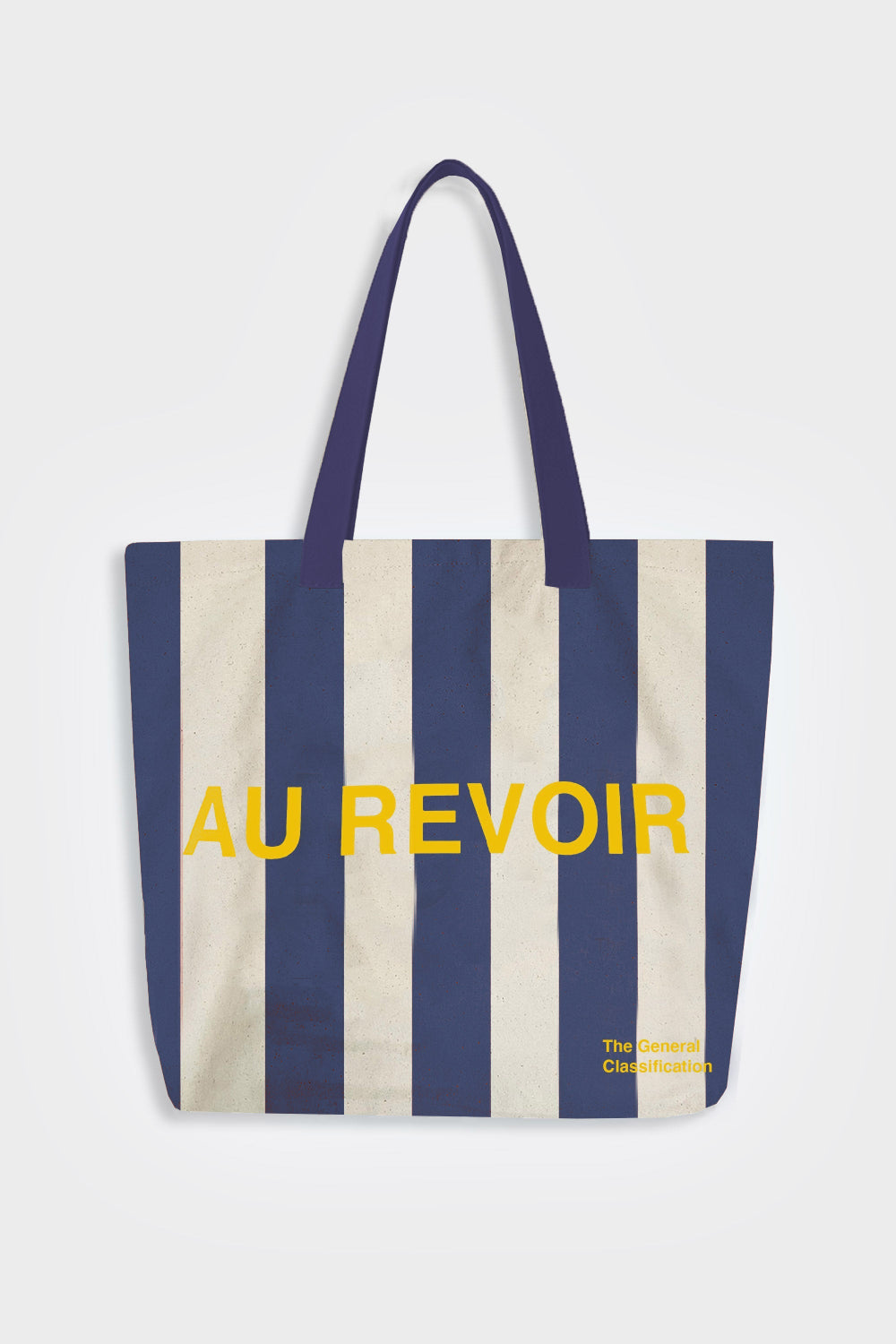 Striped tote bag with 'AU REVOIR' text on a white background