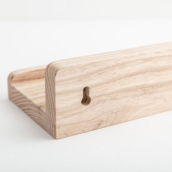 Wooden shelf with a hook on a white background