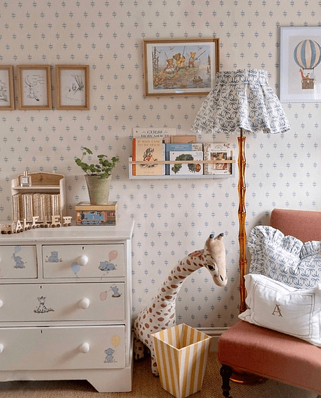 Children's room with patterned wallpaper, furniture, and decor elements.
