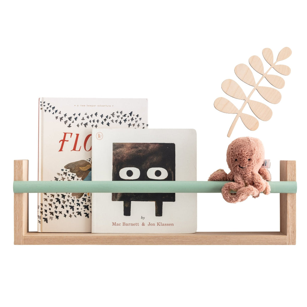 Wooden shelf with books and a plush toy on a white background