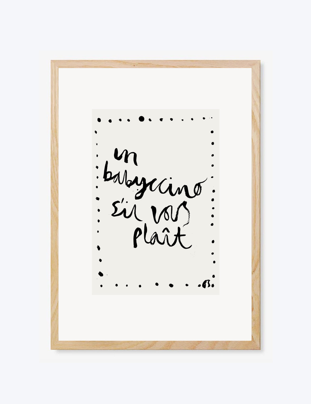 Framed artwork with black 'babyccino' text on a white background