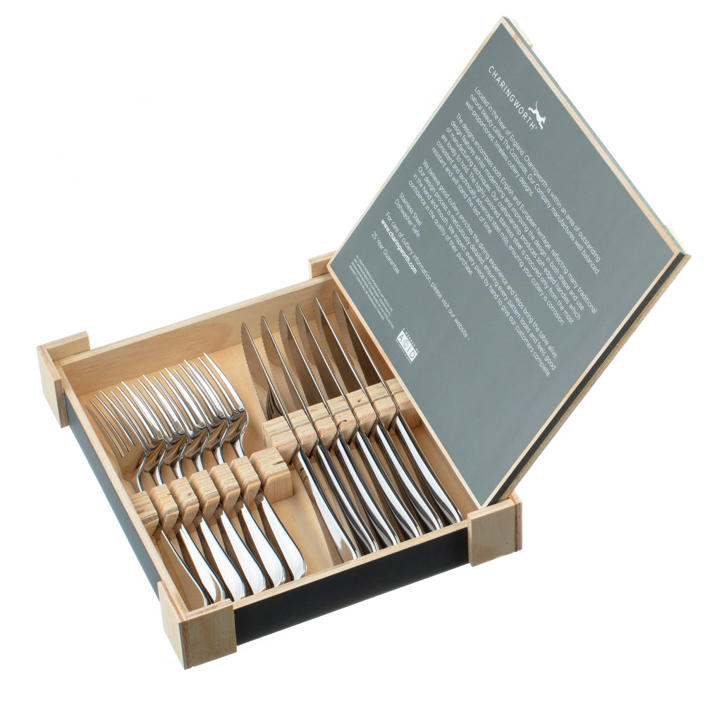 Set of Steak knife and forks in a wooden box with a green label on a white background