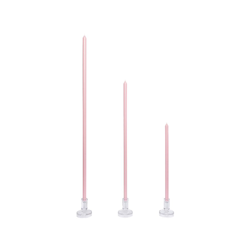 Three pink candles on white stands against a white background