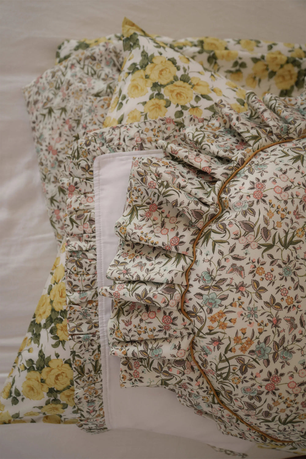 Floral patterned fabric with ruffled edges on a white background