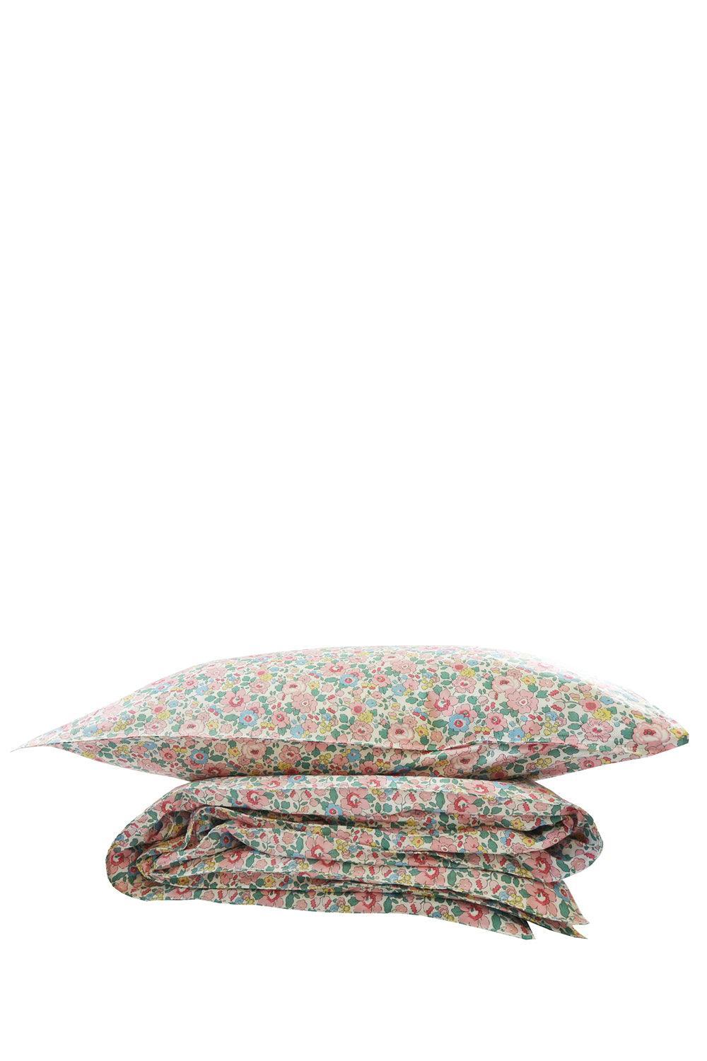 Floral bedding set with a pillow and duvet on a white background