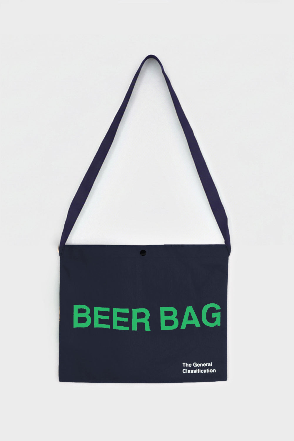 A dark navy blue shoulder bag with a matching strap, featuring the words 'BEER BAG' printed in bright green across the front, and small white text reading 'The General Classification' in the bottom right corner. The bag is displayed flat against a light gray background.