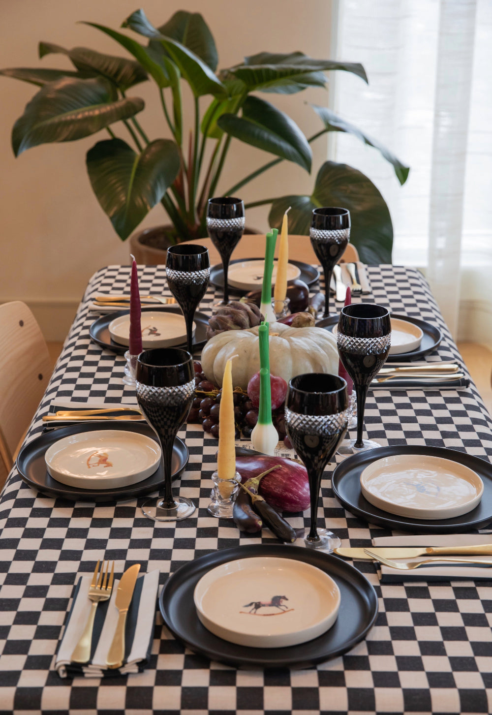 Black and white checkerboard tablecloth used for an autumn table setting