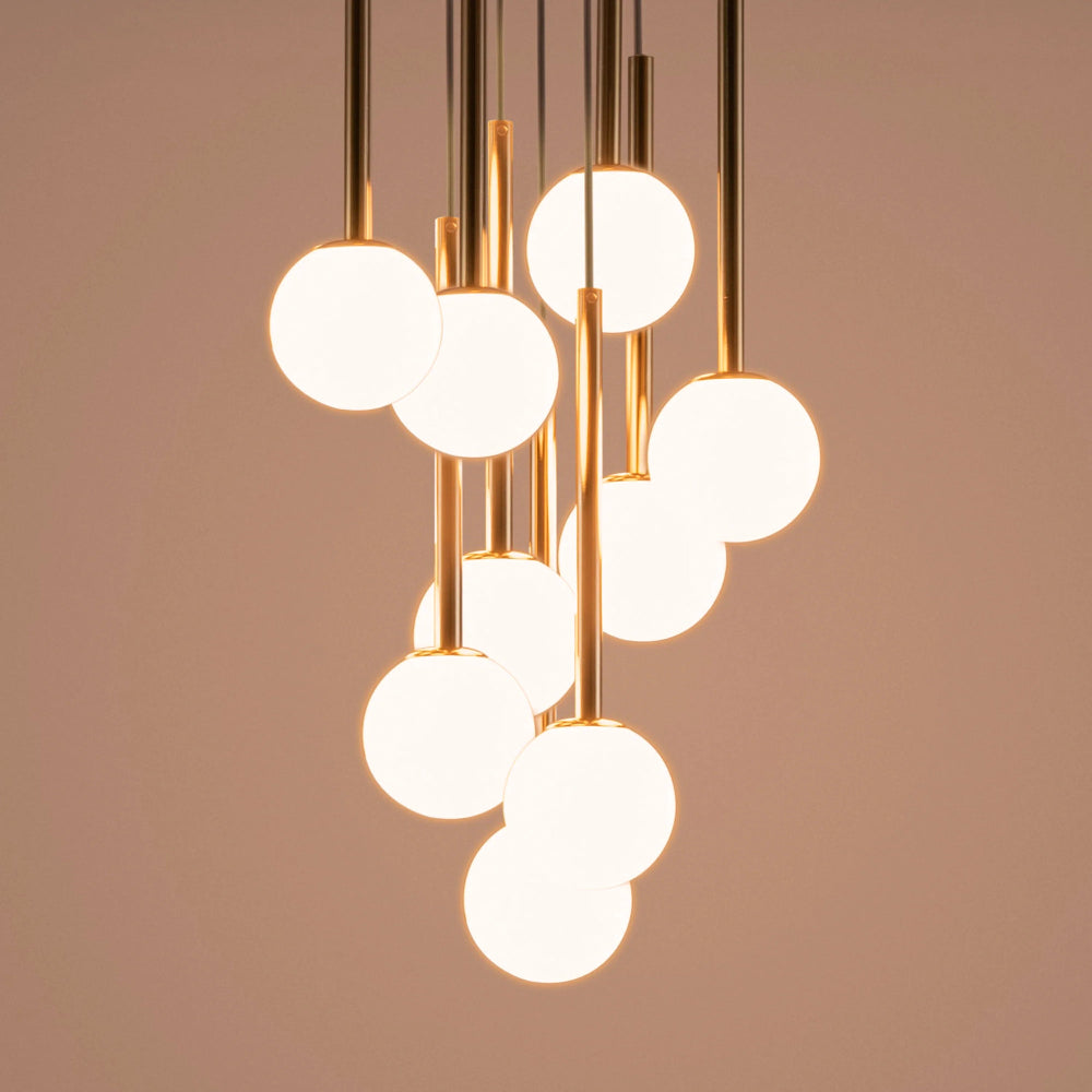 Front view of brass cluster ceiling light with sculptural glass globes