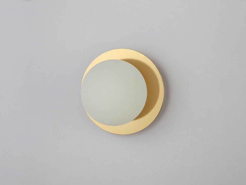 Side view showing the projection of the brass opal disk wall light