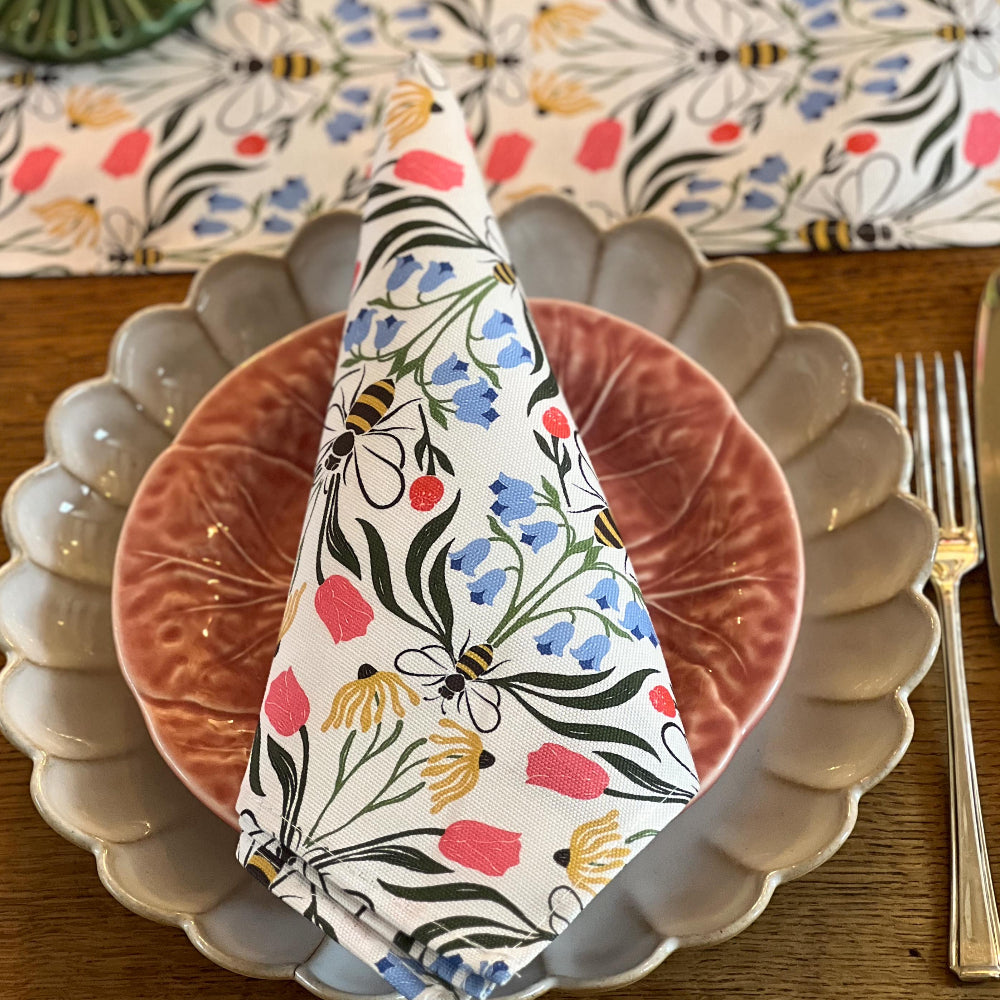 Floral-patterned napkin on a plate with a decorative background