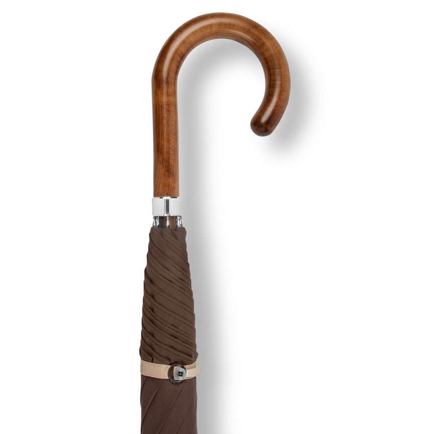 Brown umbrella with wooden handle on a white background