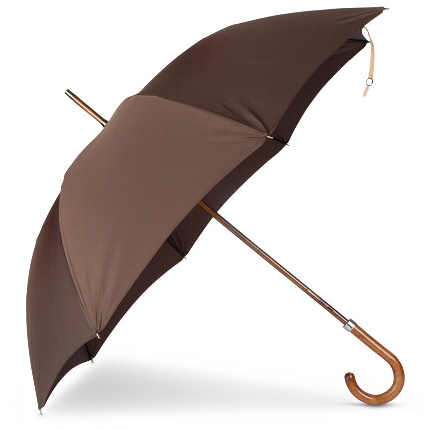 Brown umbrella with wooden handle on a white background