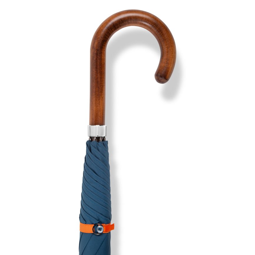 Blue umbrella with a wooden handle on a white background