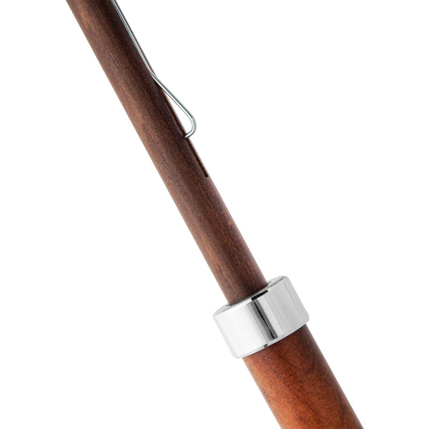 Wooden umbrella handle with a silver clip on a white background