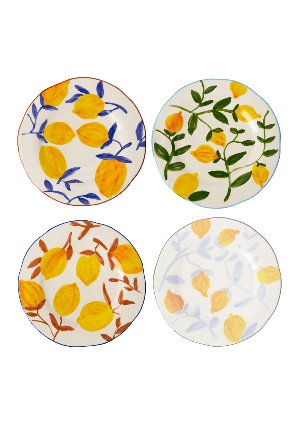 Four ceramic plates with lemon designs on a white background