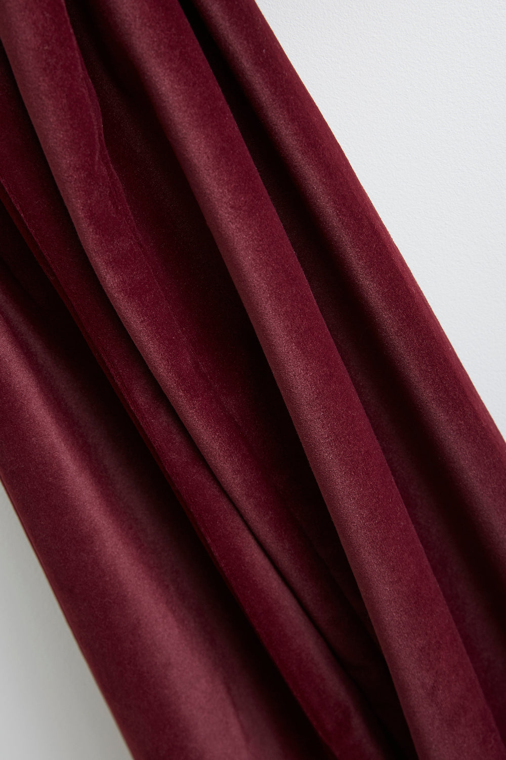 Close-up of the rich burgundy velvet fabric on the Kika Bespoke Christmas bow