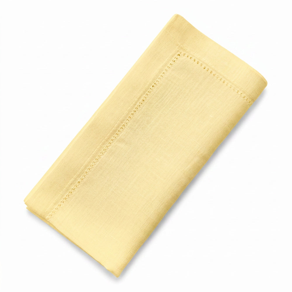 Buttermilk linen napkin on a white background