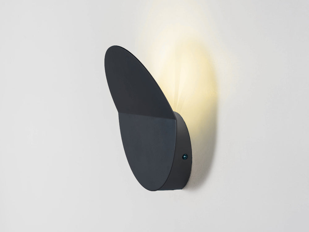 Modern wall-mounted light fixture on a white background