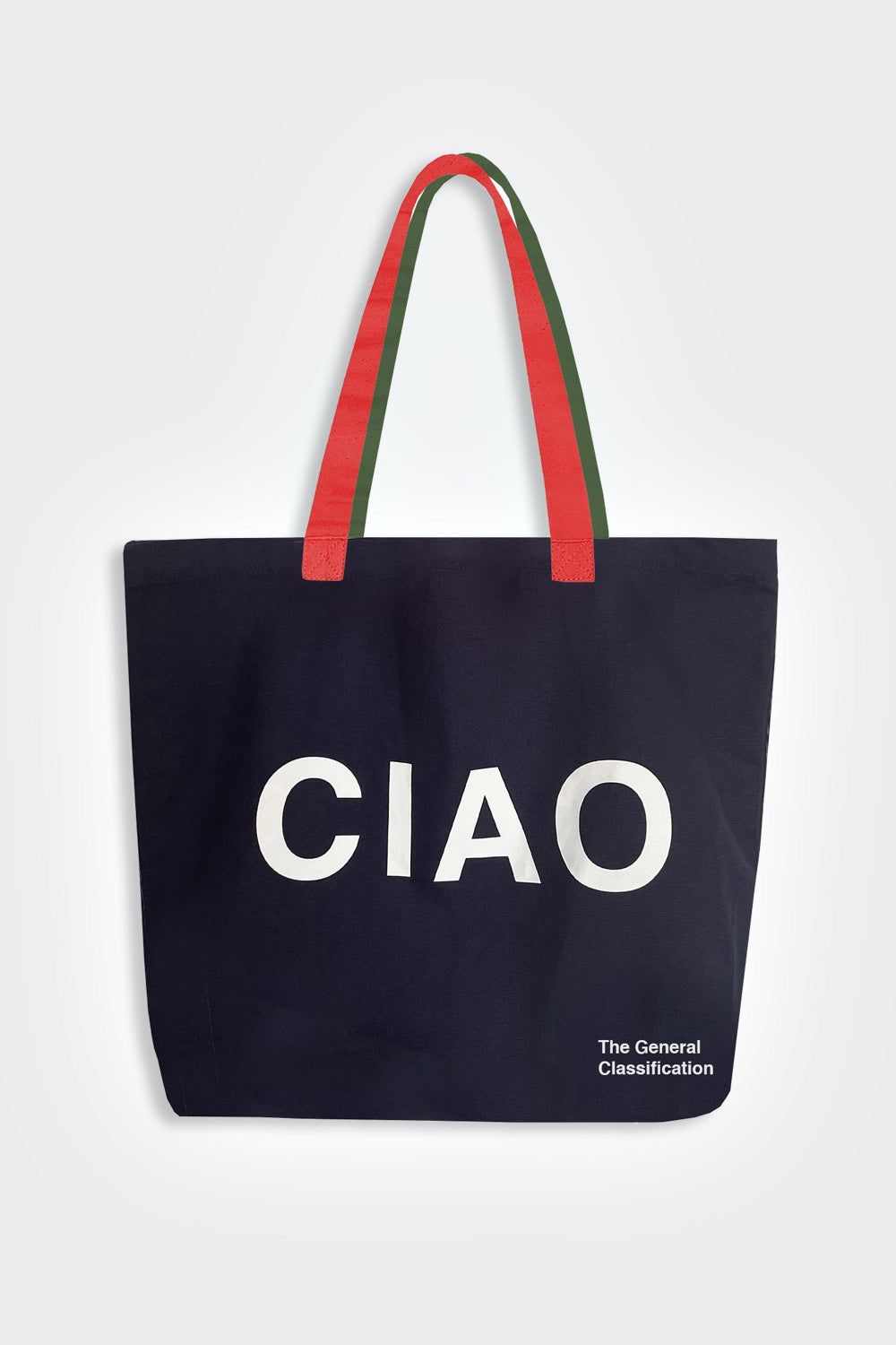 A navy blue canvas tote bag with red and green handles, featuring the word 'CIAO' printed in large white letters on the front, with 'The General Classification' in small white text in the bottom right corner, set against a light gray background.