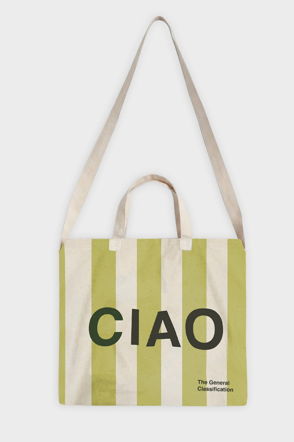 A canvas tote bag with vertical light green and cream stripes, featuring the word 'CIAO' in bold black letters and 'The General Classification' in smaller text. It has two cream fabric handles and is photographed against a light grey background.