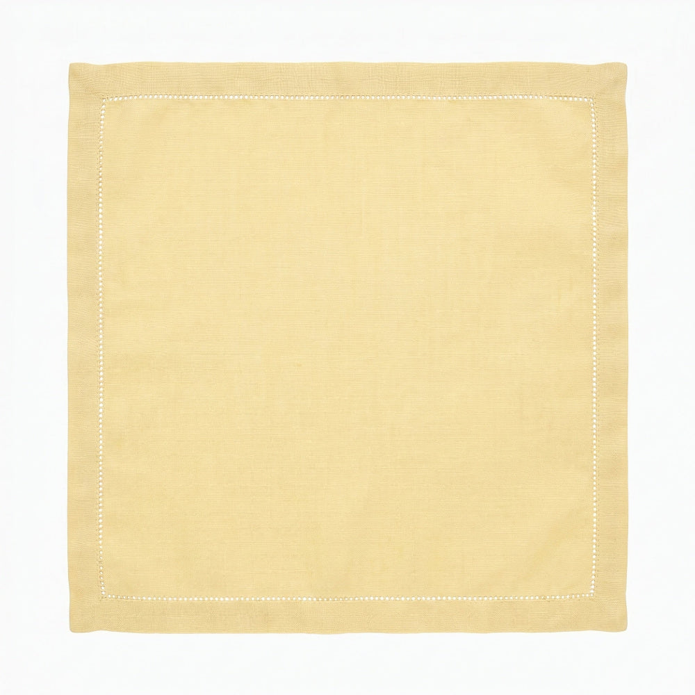 Yellow square napkin with hempstiched border on a white background