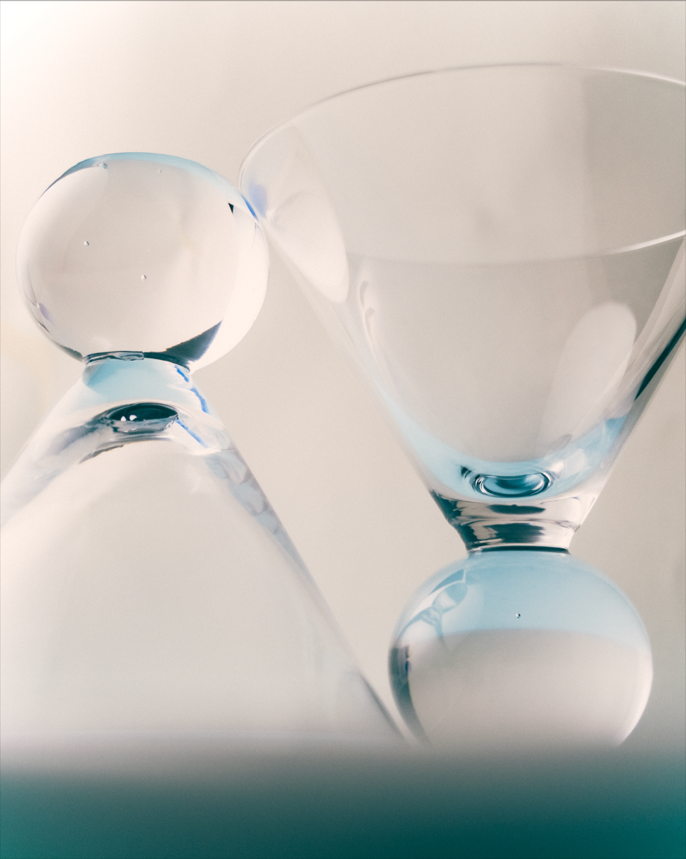 Close-up of a cocktail glasses with blue accents on a white background