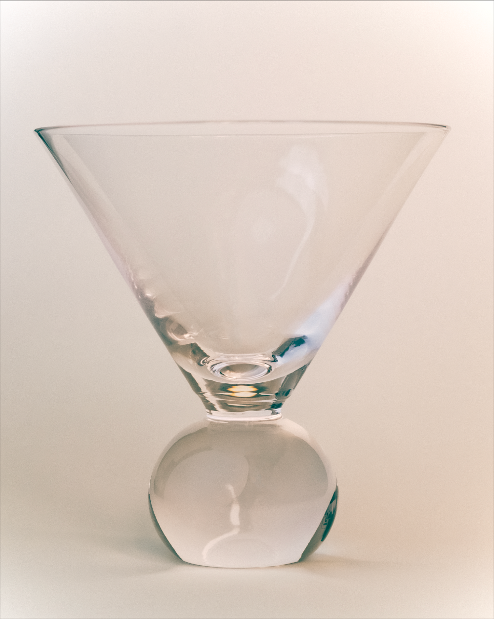 Clear glass martini glass on a white background