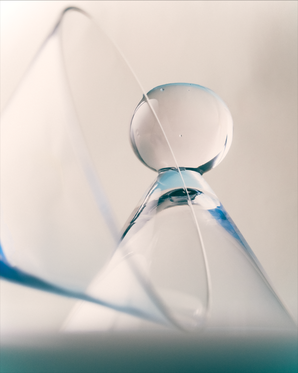 Close-up of a cocktail glass with bobble stem.
