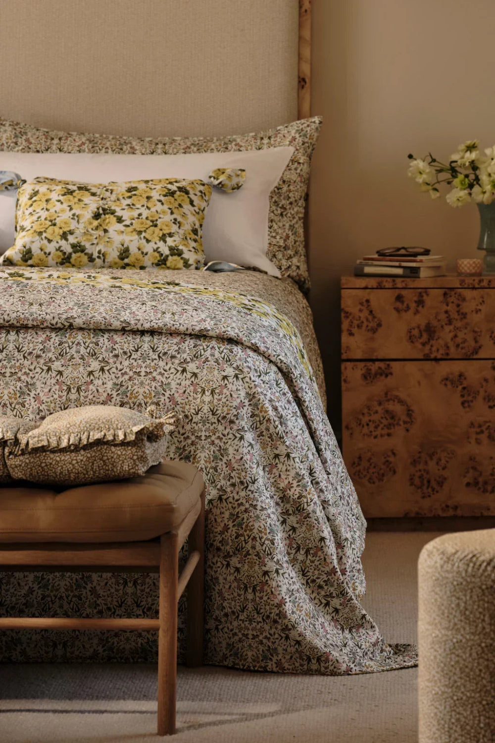 Bedroom with floral bedding and patterned furniture