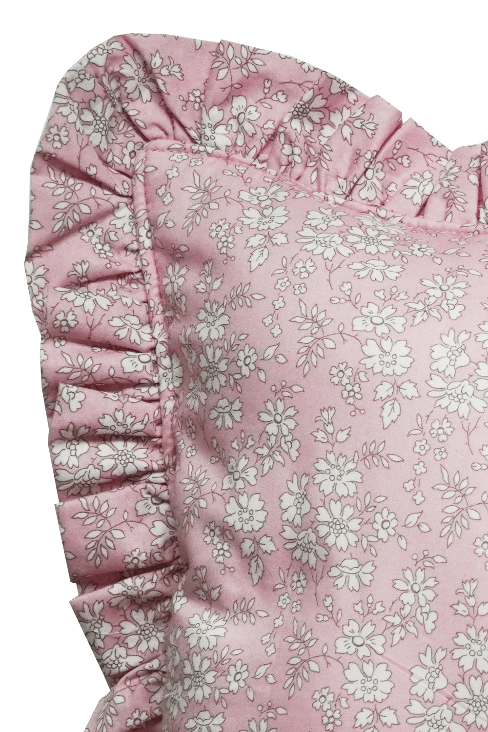 Close-up of a pink floral lumbar cushion with ruffled trim on a gray background