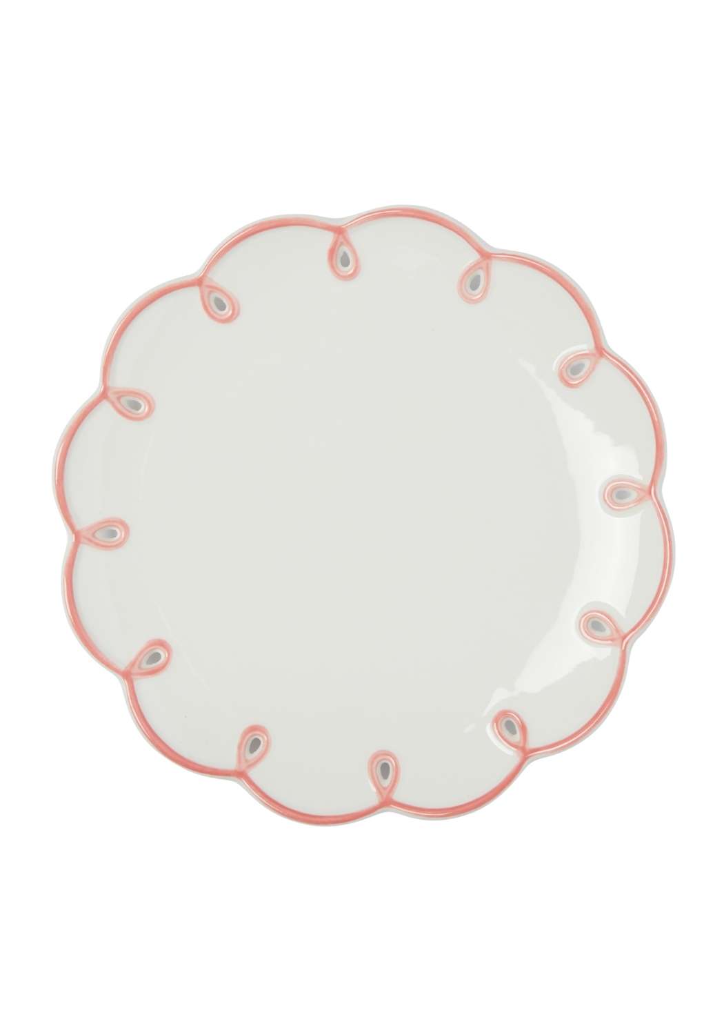 White plate with pink scalloped decorative edge on a white background