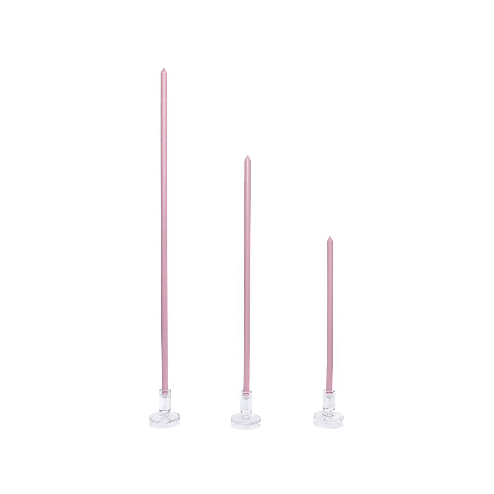 Three pink candles on white stands against a white background
