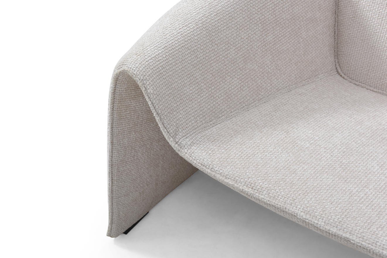 Close-up of a textured cream modern armchair on a white background