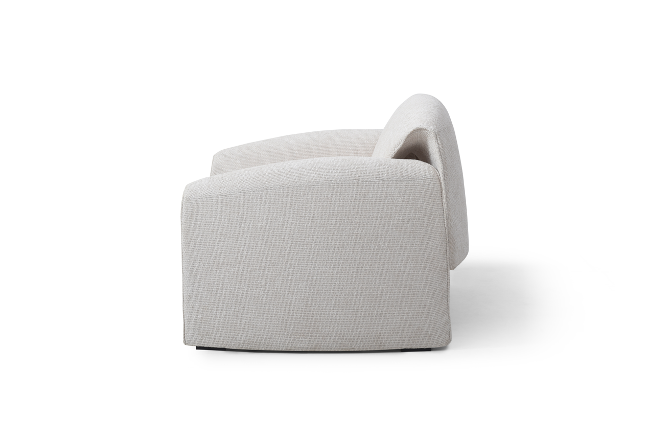 Cream modern lounge armchair on a white background