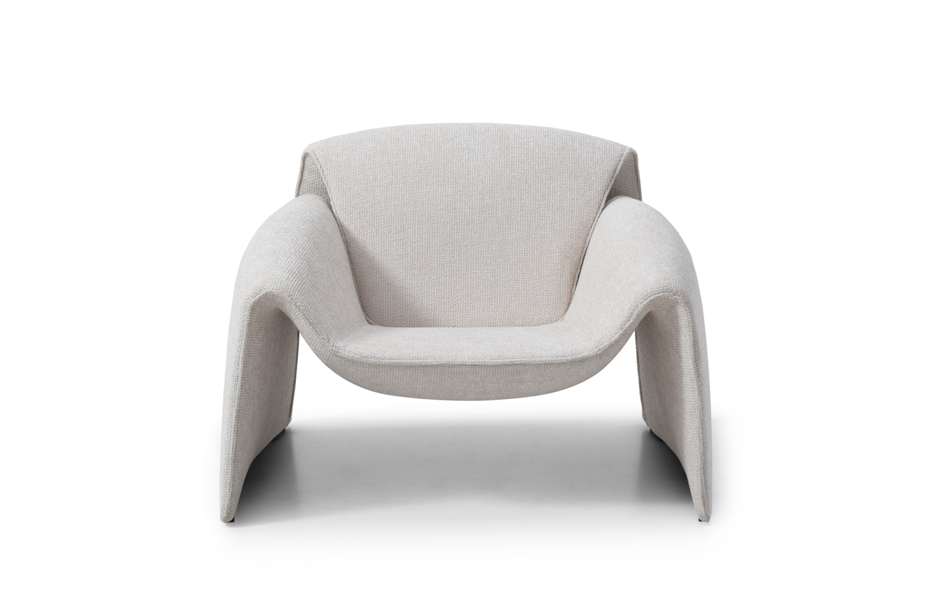 Modern cream lounge armchair on a white background