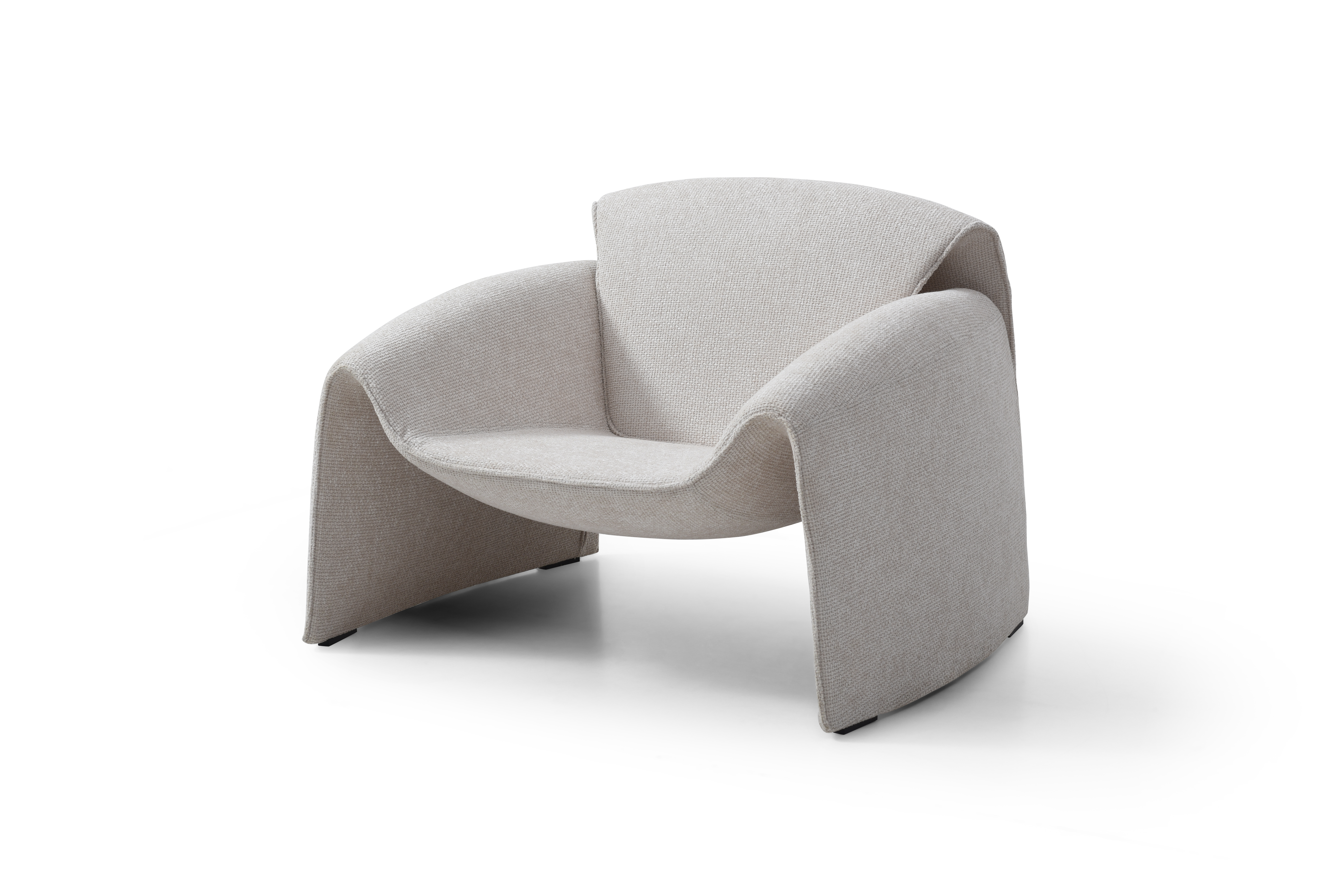 Modern cream relaxing lounge armchair on a white background