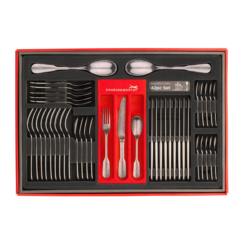A 42 piece set of silver flatware with a vintage satin finish including a table knife, table fork, dessert spoon, and teaspoons.