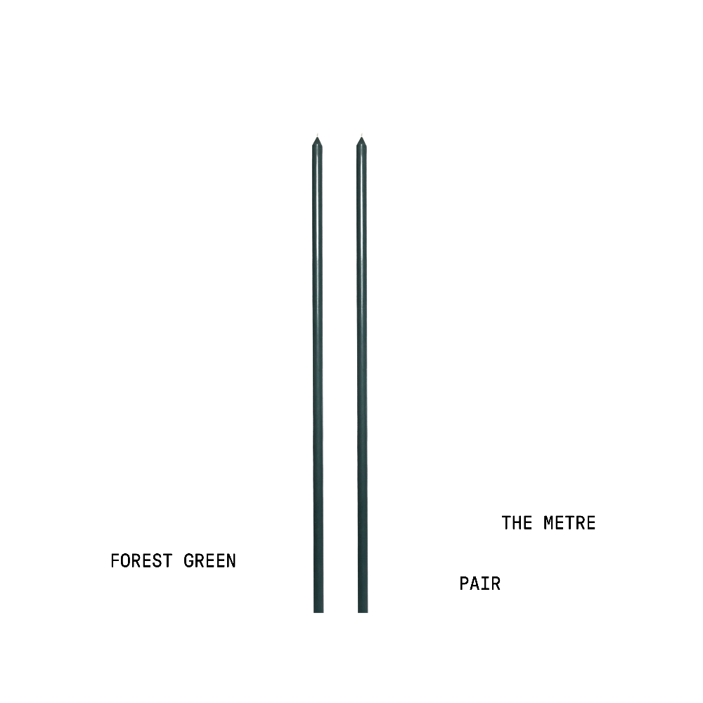 Two handpoured tapered candles labelled 'Forest Green' and 'The Metre Pair' on a white background.
