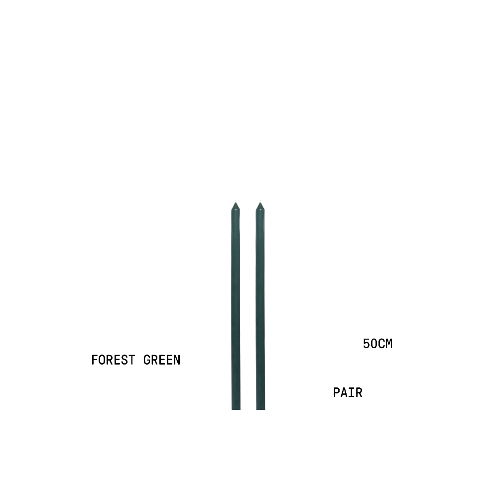 Two forest green tapered candles with measurement text on a white background