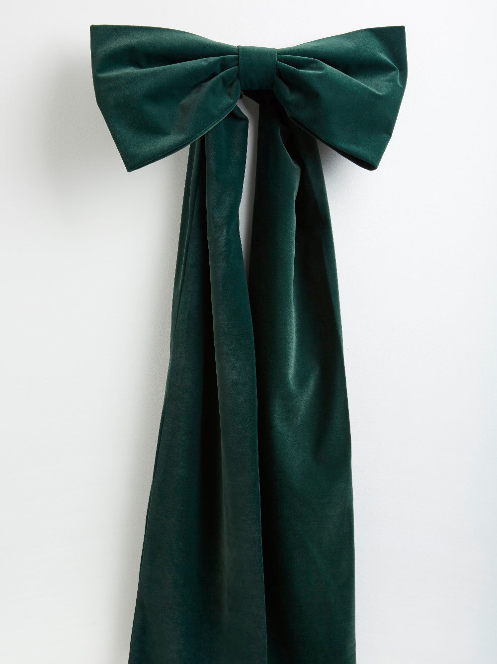 Detail of the rich forest green velvet used for the oversized Christmas bow