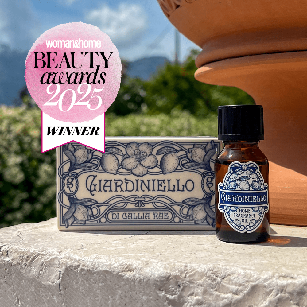 Giardiniello home fragrance oil bottle with a decorative box on a stone surface, featuring a 'Woman's Home Beauty Awards 2025 Winner' badge.